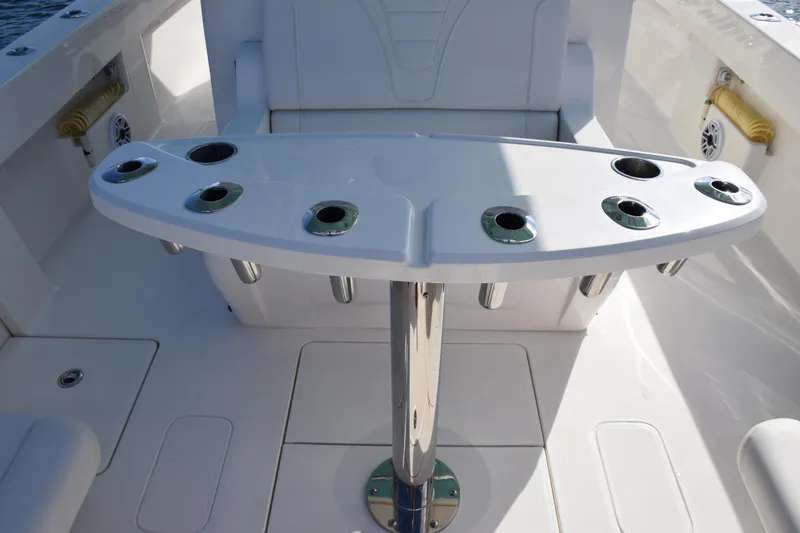 Slide: The Image of 2022 SeaVee 390Z boat with rod holders and seating area. - 10