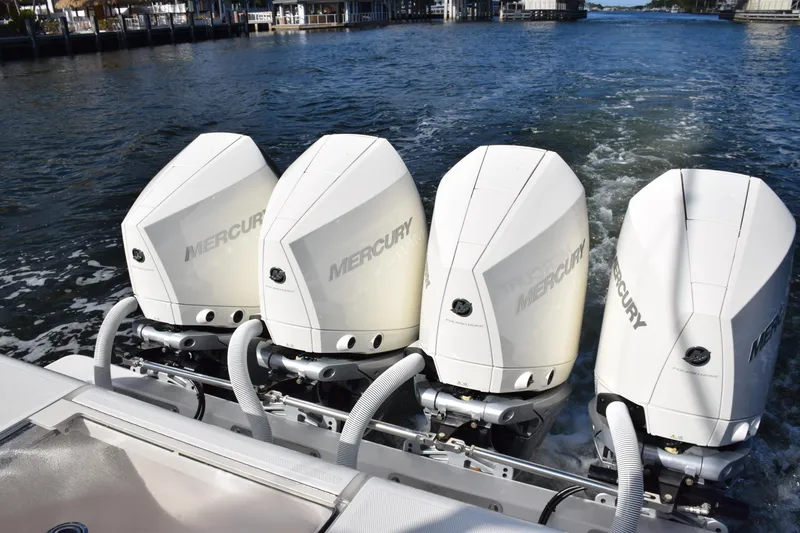 Slide: The Image of 2022 SeaVee 390Z boat with four powerful Mercury outboard engines on the water. - 8