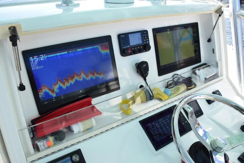 Slide: The Image of 2022 SeaVee 390Z helm with advanced navigation and communication displays. - 22