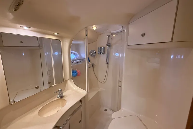 Slide: The Image of Luxurious bathroom in 2004 Sea Ray 480 Sedan Bridge yacht, featuring modern fixtures and elegant design. - 39