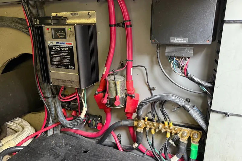 Slide: The Image of Electrical components and wiring inside a 2004 Sea Ray 480 Sedan Bridge boat. - 51