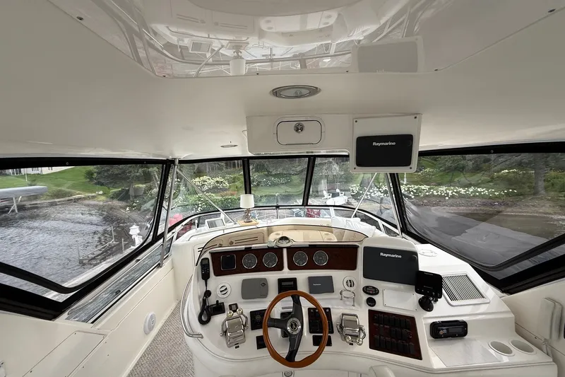 Slide: The Image of Interior view of 2004 Sea Ray 480 Sedan Bridge yacht cockpit with navigation equipment. - 15