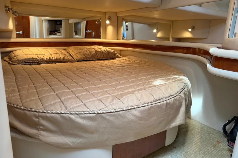 Slide: The Image of Luxurious cabin interior of 2004 Sea Ray 480 Sedan Bridge yacht with cozy bedding. - 35