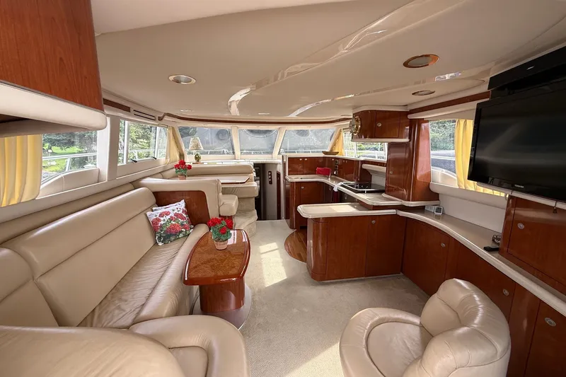Slide: The Image of Luxurious interior of a 2004 Sea Ray 480 Sedan Bridge yacht with elegant furnishings. - 21