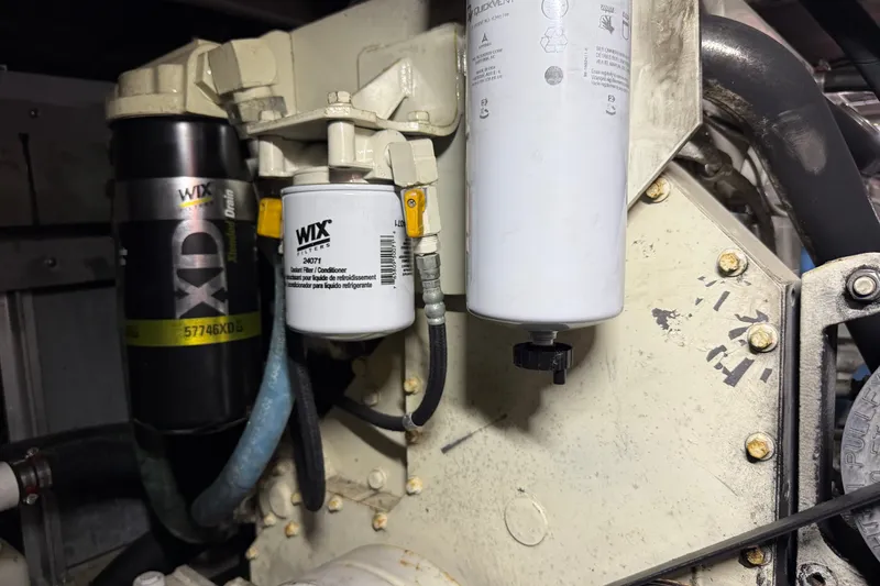 Slide: The Image of Engine compartment of a 2004 Sea Ray 480 Sedan Bridge with Wix filters visible. - 50