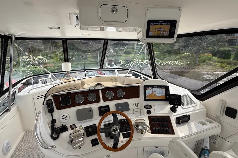 Slide: The Image of Interior view of 2004 Sea Ray 480 Sedan Bridge yacht cockpit with navigation equipment. - 17