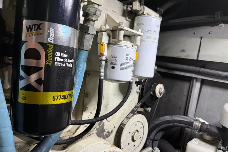 Slide: The Image of Engine compartment of a 2004 Sea Ray 480 Sedan Bridge with Wix oil filter. - 49
