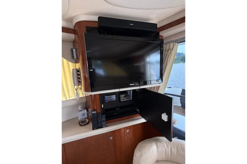 Slide: The Image of Entertainment system inside 2004 Sea Ray 480 Sedan Bridge yacht with TV and sound system. - 24