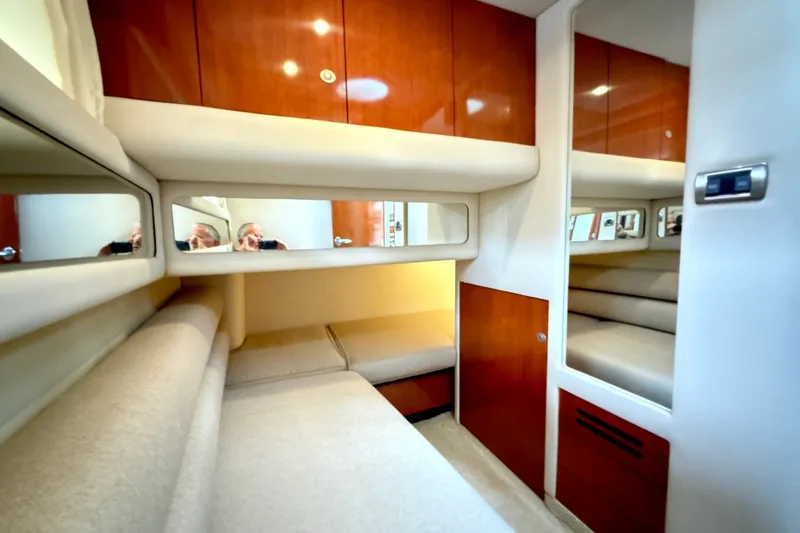 Slide: The Image of Luxurious cabin interior of 2004 Sea Ray 480 Sedan Bridge yacht with wood finishes. - 41