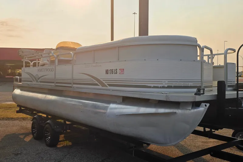Slide: The Image of 2003 Northwood 2223 Traditions pontoon boat on trailer, parked outdoors. - 4