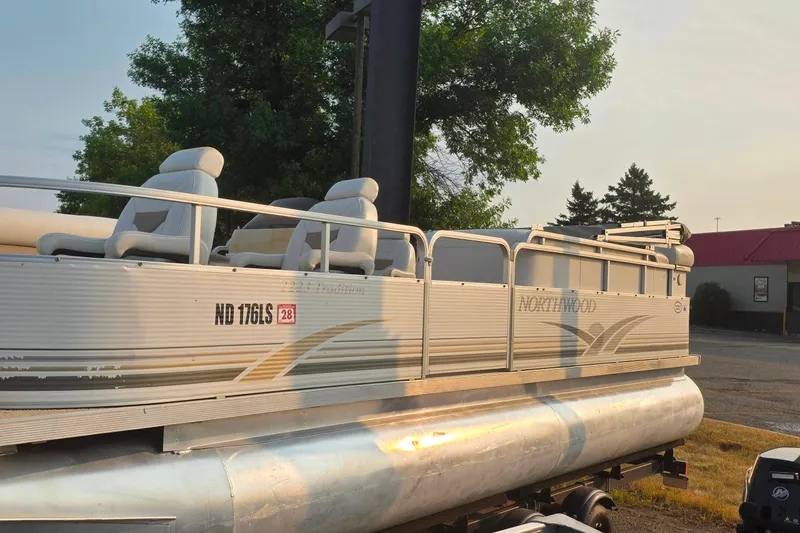 Slide: The Image of 2003 Northwood 2223 Traditions pontoon boat with seating, parked outdoors. - 3