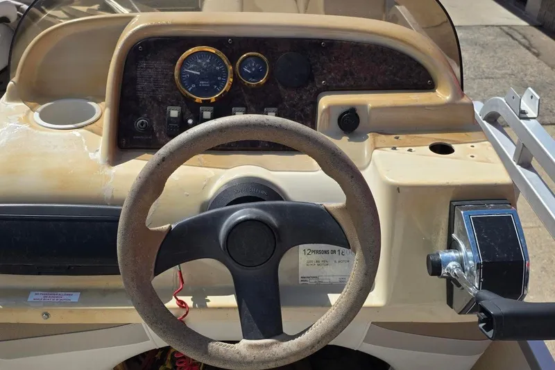 Slide: The Image of Steering console of a 2003 Northwood 2223 TRADITIONS boat with gauges and controls. - 8