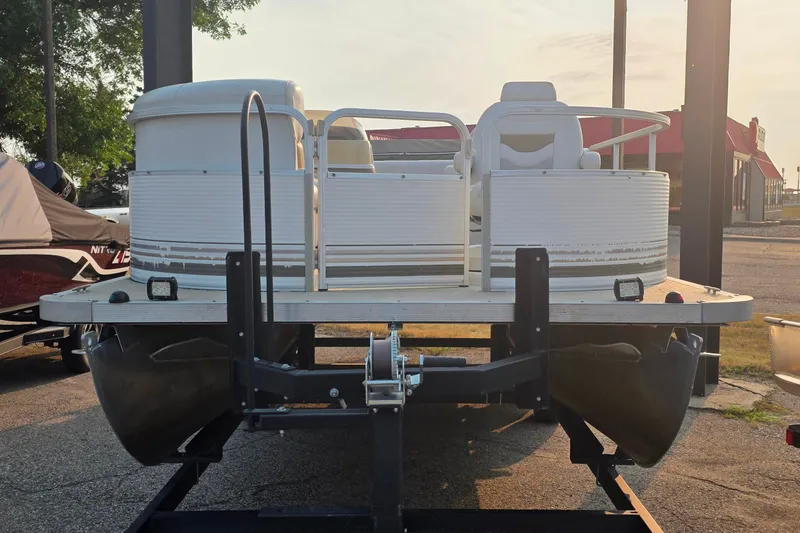 Slide: The Image of 2003 Northwood 2223 TRADITIONS pontoon boat on trailer, parked outdoors. - 6