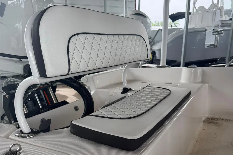 Slide: The Image of 2025 Clearwater 21 Bay boat interior with diamond-stitched seating and modern design. - 5