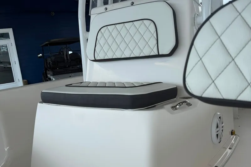 Slide: The Image of 2025 Clearwater 21 Bay boat interior with cushioned seating and modern design. - 10