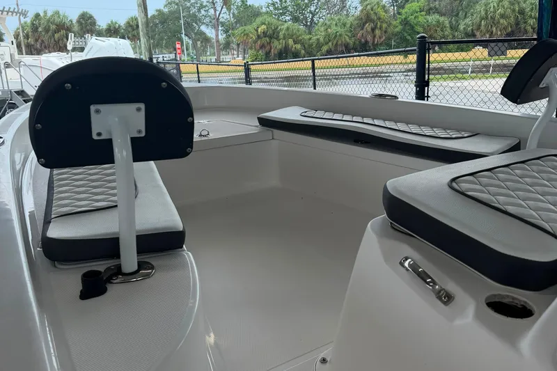 Slide: The Image of Interior view of a 2025 Clearwater 21 Bay boat with cushioned seating. - 9
