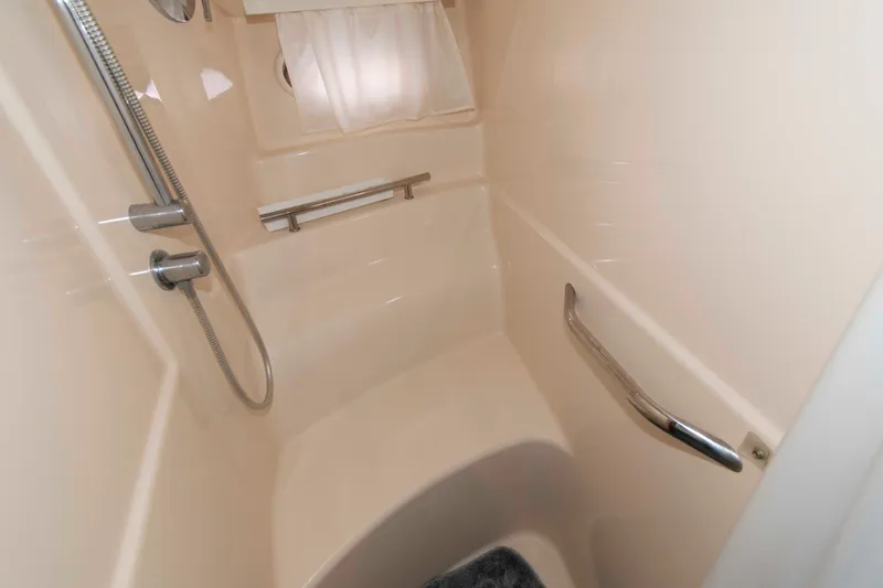 Slide: The Image of Shower area in 2009 Sea Ray Sundancer 400 yacht, featuring modern fixtures and grab bars. - 18