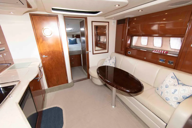 Slide: The Image of Luxurious interior of 2009 Sea Ray Sundancer 400 yacht with elegant seating and wooden finishes. - 11