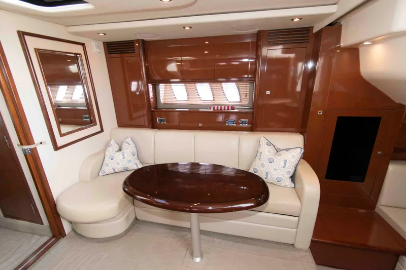 Slide: The Image of Luxurious interior of 2009 Sea Ray Sundancer 400 yacht with elegant seating and wooden table. - 13