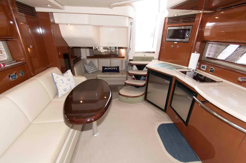 Slide: The Image of Luxurious interior of 2009 Sea Ray Sundancer 400 yacht with modern kitchen and seating area. - 10