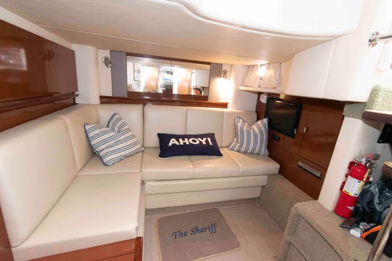 Slide: The Image of Interior of 2009 Sea Ray Sundancer 400 yacht with cozy seating and nautical decor. - 16