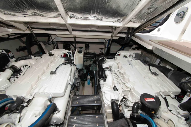 Slide: The Image of Engine room of a 2009 Sea Ray Sundancer 400 yacht, showcasing dual engines. - 19