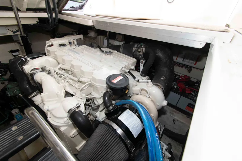 Slide: The Image of Engine compartment of a 2009 Sea Ray Sundancer 400 yacht, showcasing detailed machinery. - 20