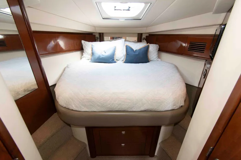 Slide: The Image of Luxurious cabin interior of 2009 Sea Ray Sundancer 400 yacht with cozy bedding. - 14
