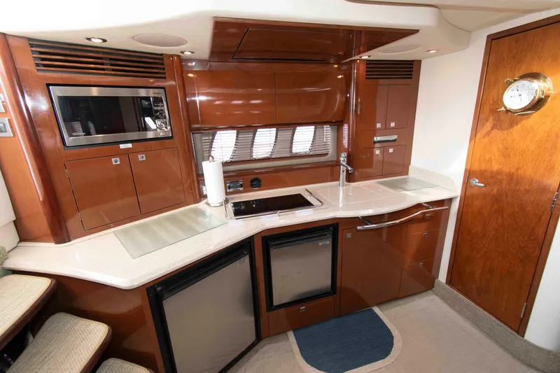 Slide: The Image of Luxurious 2009 Sea Ray Sundancer 400 yacht kitchen with modern appliances and sleek cabinetry. - 12