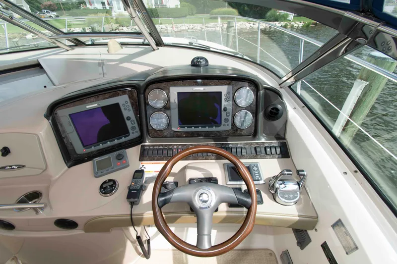 Slide: The Image of Cockpit of 2009 Sea Ray Sundancer 400 with navigation instruments and steering wheel. - 5