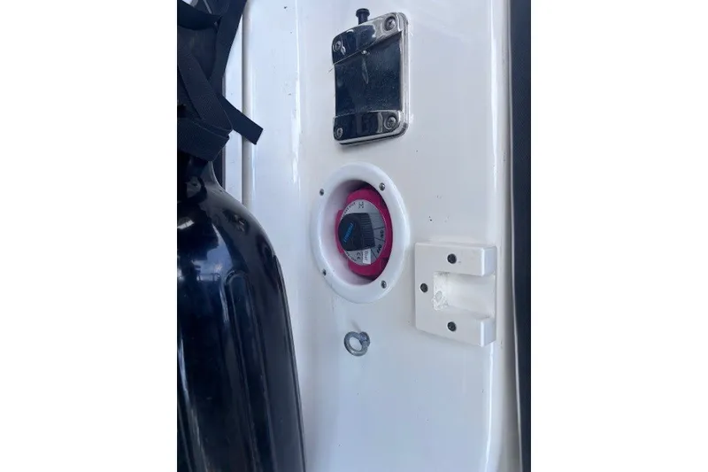 Slide: The Image of 2013 Yamaha Boats 212X control panel with switch and black fender. - 11