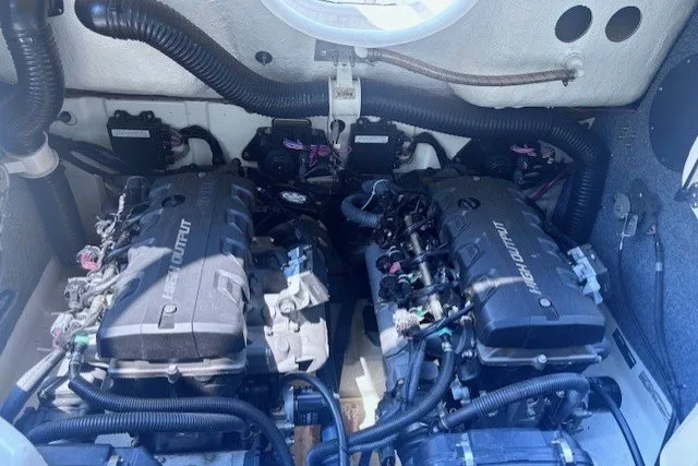 Slide: The Image of Twin engines of a 2013 Yamaha Boats 212X, showcasing high-output performance. - 18