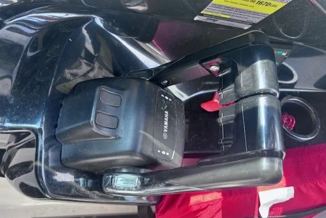 Slide: The Image of Close-up of a 2013 Yamaha Boats 212X engine component with visible branding. - 13