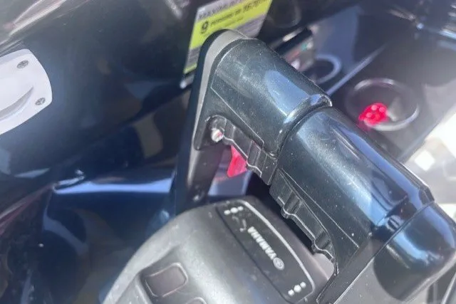 Slide: The Image of Close-up of 2013 Yamaha Boats 212X throttle control in a sleek black finish. - 17