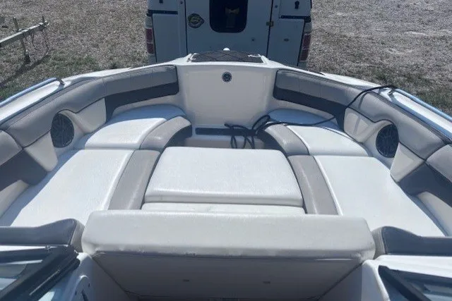 Slide: The Image of 2013 Yamaha Boats 212X interior with cushioned seating and speakers. - 7