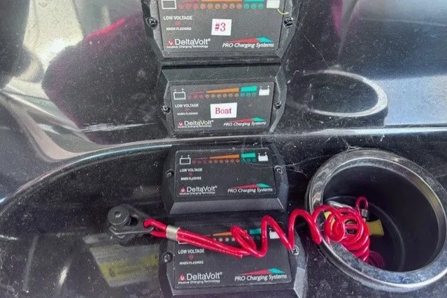 Slide: The Image of DeltaVolt charging systems in a 2013 Yamaha Boats 212X, featuring coiled red cables. - 10