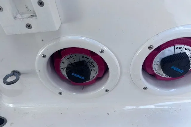 Slide: The Image of Battery switches on a 2013 Yamaha Boats 212X, featuring Perko dials. - 12