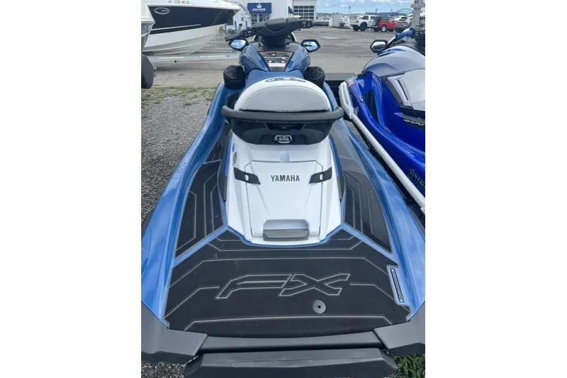 Slide: The Image of 2024 Yamaha PWC FX Cruiser SVHO in blue, parked outdoors. - 4