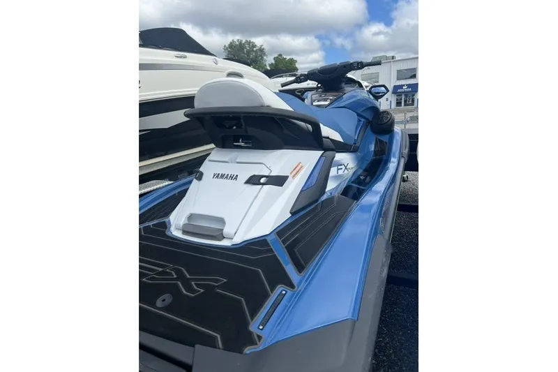 Slide: The Image of 2024 Yamaha FX Cruiser SVHO in blue, parked outdoors on a trailer. - 11