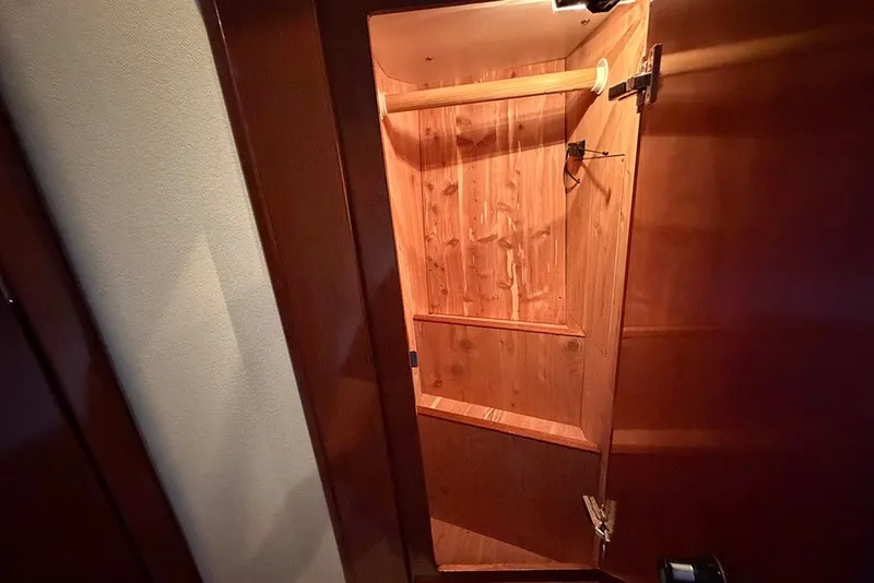 Slide: The Image of Wooden closet interior on a 2009 Meridian 391 Sedan yacht. - 28