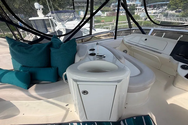 Slide: The Image of Luxurious 2009 Meridian 391 Sedan yacht interior with teal cushions and sleek design. - 40