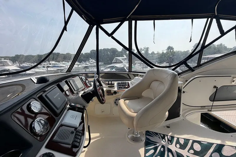 Slide: The Image of Interior view of 2009 Meridian 391 Sedan yacht cockpit with steering wheel and controls. - 29