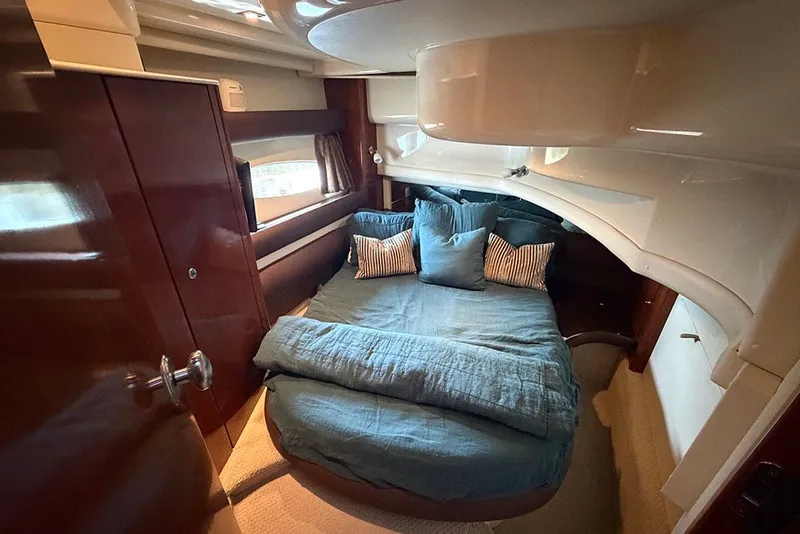 Slide: The Image of Luxurious bedroom interior of 2009 Meridian 391 Sedan yacht with cozy bedding. - 25