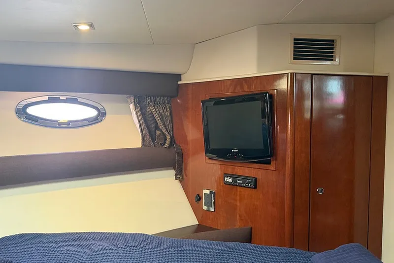 Slide: The Image of Interior cabin of 2009 Meridian 391 Sedan with TV and porthole window. - 21