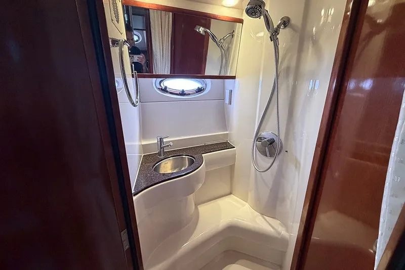 Slide: The Image of Luxurious bathroom in 2009 Meridian 391 Sedan yacht with modern fixtures and shower. - 24