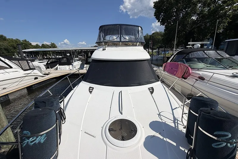 Slide: The Image of 2009 Meridian 391 Sedan yacht docked at marina under clear blue sky. - 42