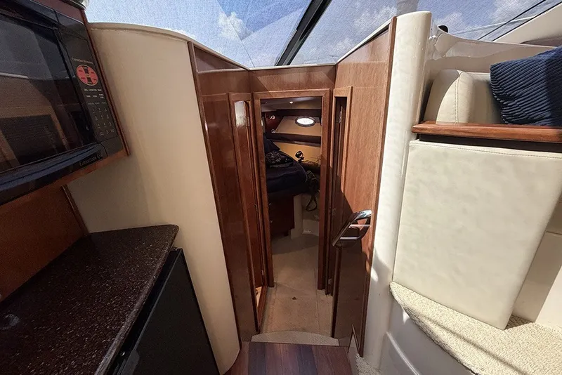 Slide: The Image of Interior view of 2009 Meridian 391 Sedan yacht with wood finishes and modern amenities. - 16