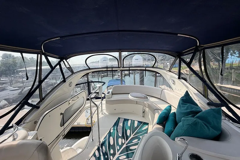 Slide: The Image of Interior view of a 2009 Meridian 391 Sedan yacht with seating and cushions. - 38