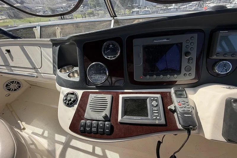 Slide: The Image of 2009 Meridian 391 Sedan helm with navigation controls and gauges in a sleek design. - 32