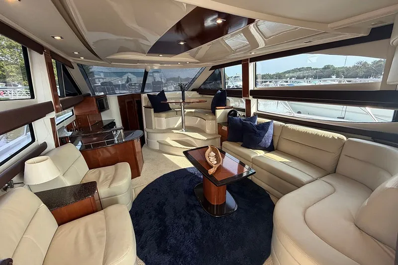 Slide: The Image of Luxurious interior of a 2009 Meridian 391 Sedan yacht with plush seating and elegant decor. - 10